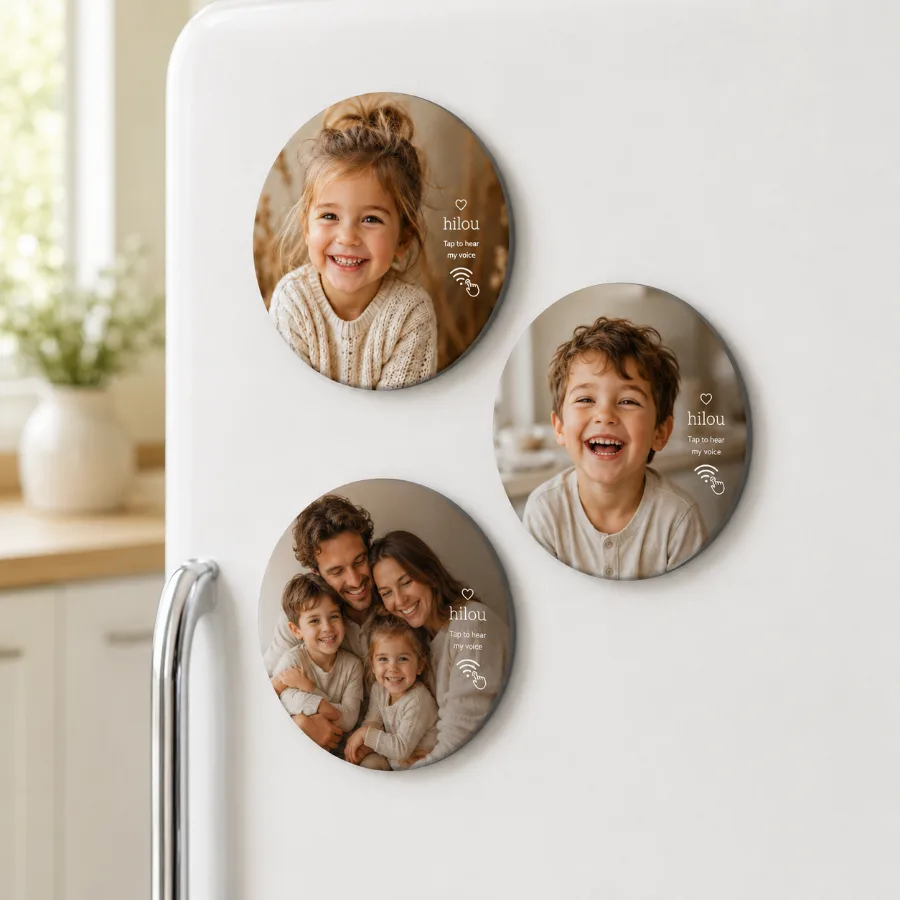 Three round hilou photo magnets of grandchildren on a fridge